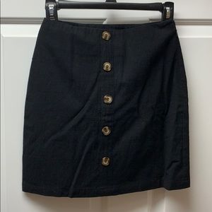 Black mock button mini skirt